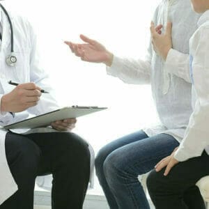 doctor talking to patients
