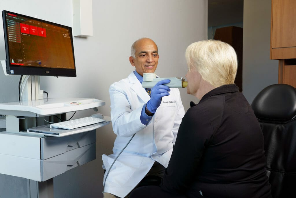 Dr. Pandhi evaluating patient with sleep study