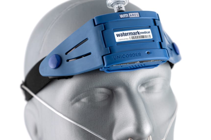 A mannequin wears a Watermark Medical ARES headband device for sleep study diagnostics